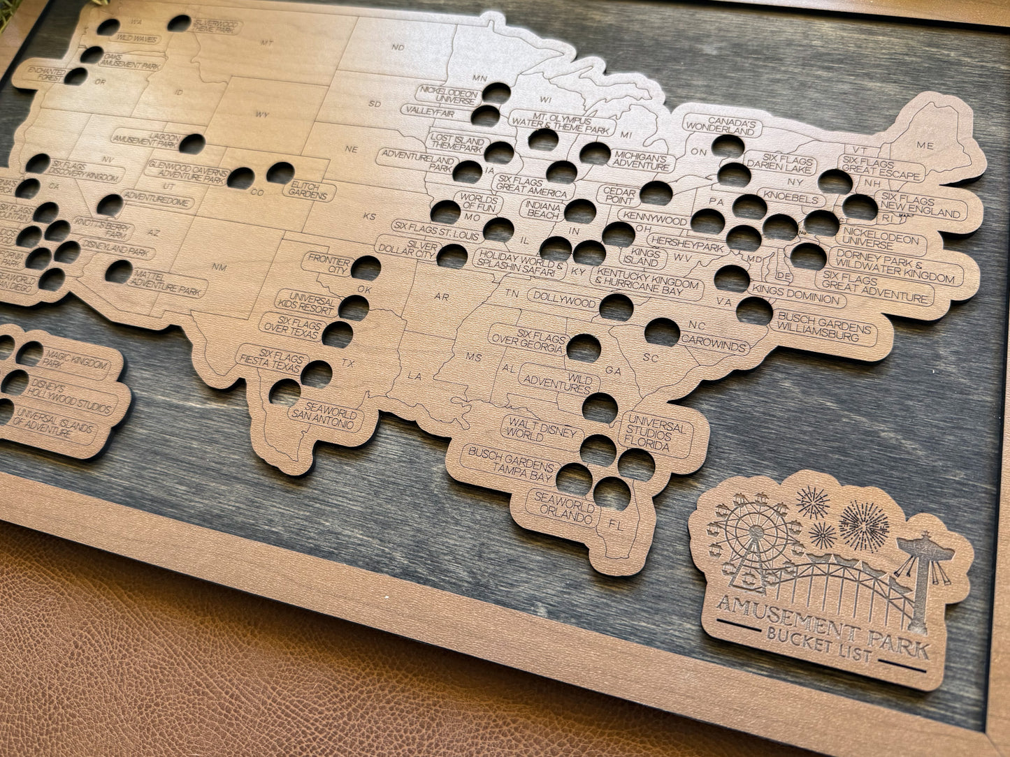 Wooden map with cut-out shapes and text on a wooden board