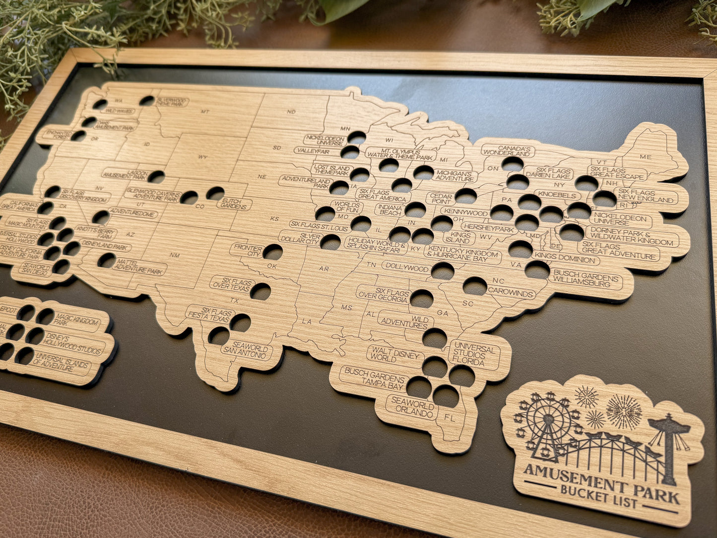 Wooden map of the United States with cut-out states on a dark surface