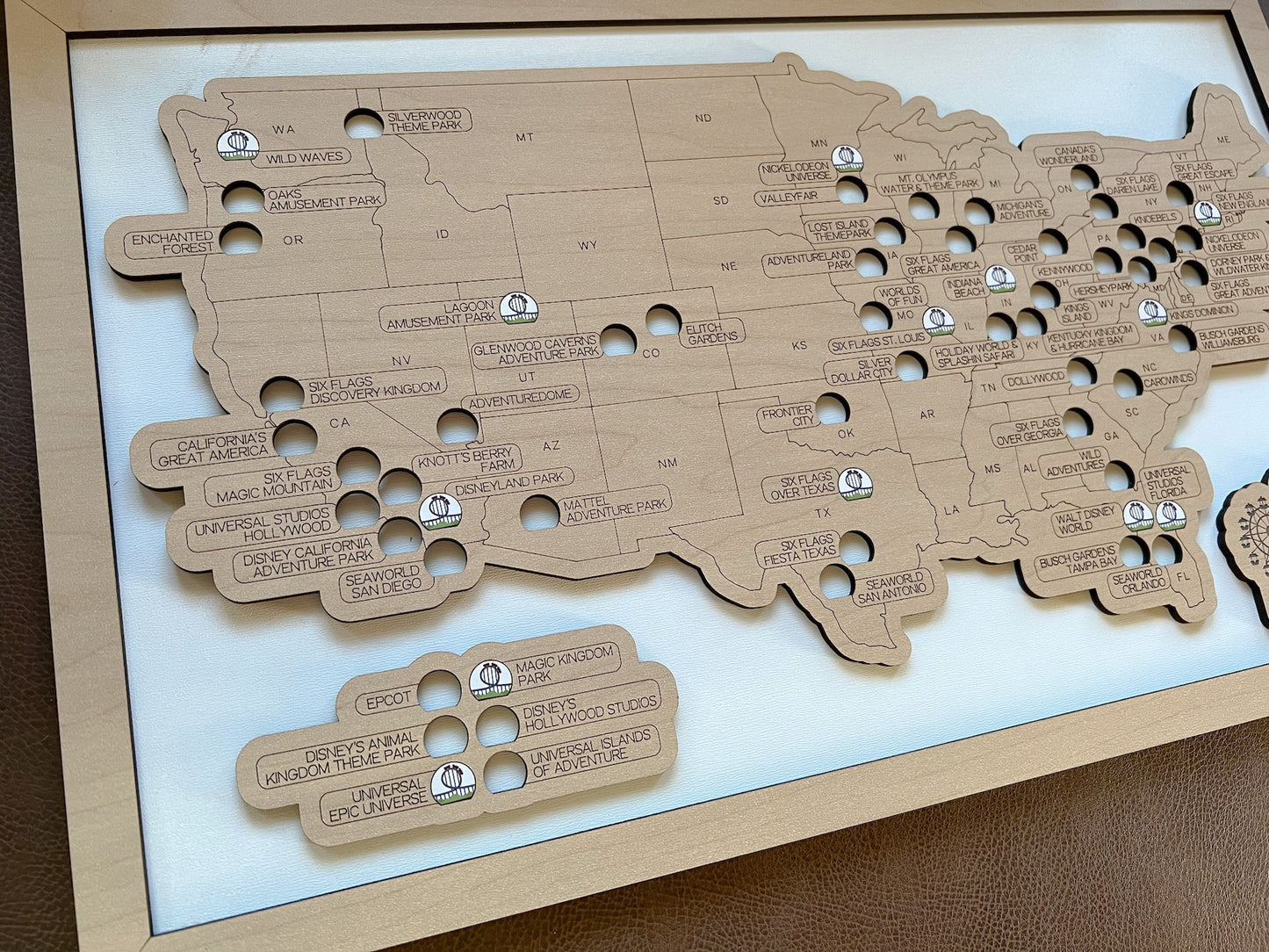Wooden map of the United States with engraved text on a white background
